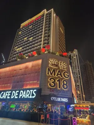 a large building with a sign in front of it at Chic Studio 5 Min Walk to Dubai Mall & Burj in Dubai