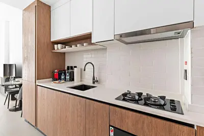 a kitchen with a sink and a stove top oven at Modern Studio in Al Furjan with pool and gym in Dubai