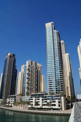 a group of tall buildings in a city with water at HAVN - 1 Bed in Dubai Marina, 5mins walk to JBR in Dubai