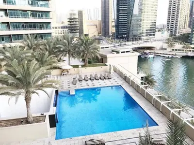a large swimming pool on top of a building at HAVN - 1 Bed in Dubai Marina, 5mins walk to JBR in Dubai
