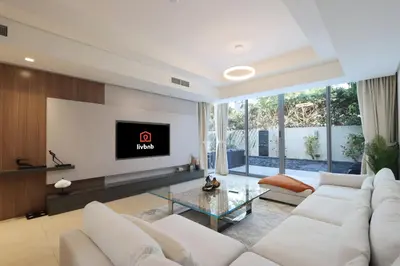 a living room with white furniture and a flat screen tv at Livbnb-Tranquil Family Home, 4BR with Maid's Room in Dubai
