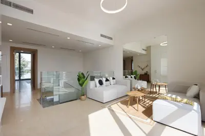 a living room with a white couch and a table at Livbnb-Tranquil Family Home, 4BR with Maid's Room in Dubai