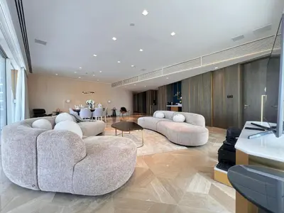 a living room with two couches and a table at Daniels 4BR at Five Palm With Private Pool in Dubai