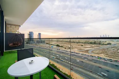 a room with a view of a highway at SettlerHomes - Chic JVC Cityview Near Heart of Dubai in Dubai