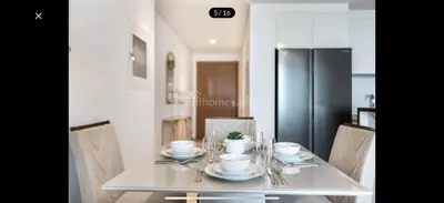 a dining room table with plates and bowls on it at Downtown holiday home in Dubai