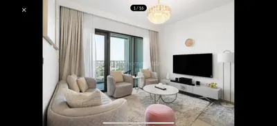 a living room with a couch and a tv at Downtown holiday home in Dubai