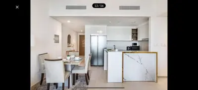 a kitchen and dining room with a table and chairs at Downtown holiday home in Dubai