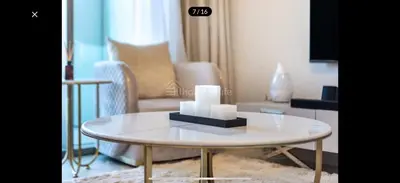 a living room with a table and a couch at Downtown holiday home in Dubai