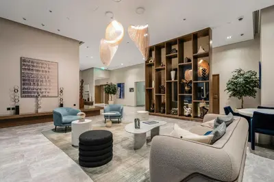 a lobby with couches and chairs and tables at Private Beach-Infinity Pool-Lux Beachfront in Dubai