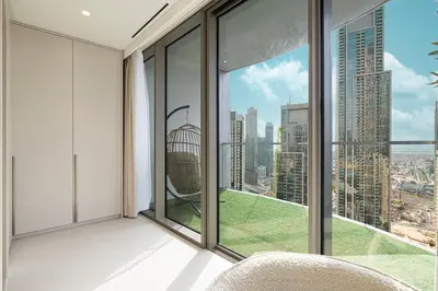 a room with a view of a city at Sky High Luxury, Grande Signature, Burj Khalifa View, 5 minute walk to Dubai Mall in Dubai