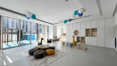 a living room with large windows and a room with a table at Sky High Luxury, Grande Signature, Burj Khalifa View, 5 minute walk to Dubai Mall in Dubai