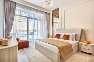 a bedroom with a bed and a large window at Luxury 1BR Haven Chic & Cozy Stay in JVC in Dubai