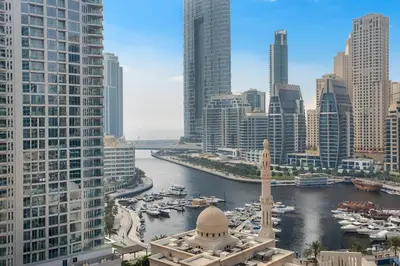 a view of a city with a river and buildings at Escan Marina Tower Skyline Studio Elegant Stay in Dubai