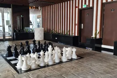a chess board is sitting on the floor in a lobby at Studio in downtown with Burj Khalifa and city view in Dubai