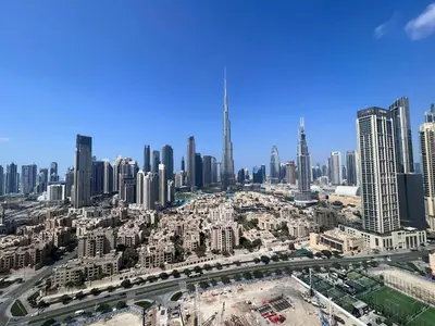 an aerial view of a city with tall buildings at The Burj Panarama in Dubai