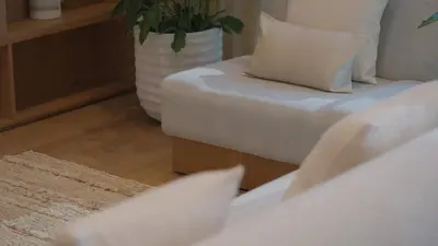 a bedroom with a white bed and a plant at Mori - luxury Burj full view in Dubai