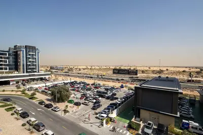 an aerial view of a parking lot with cars parked at Frank Porter - Samana Park Views in Dubai