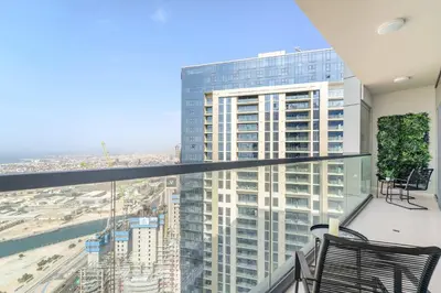 a balcony with a view of a tall building at Silkhaus Luxury 2BDR at Aykon City in Business Bay in Dubai