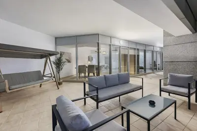 a living room with a couch and a bed and a table at FIRST CLASS 1BR Inviting Marina Views in Dubai