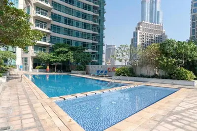 a swimming pool in a city with tall buildings at The Lofts West Downtown - 2 Minutes Walk to Burj Khalifa-Dubai Mall 1BDR in Dubai
