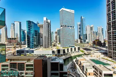 a view of a city with tall buildings at Luxury One Bedroom with Burj Khalifa View in Dubai