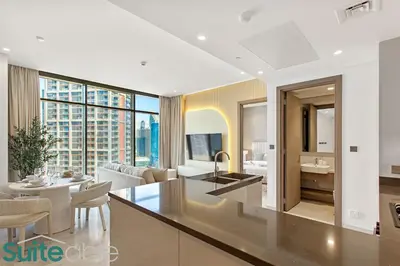 a kitchen and living room with a view of the city at Luxury One Bedroom with Burj Khalifa View in Dubai
