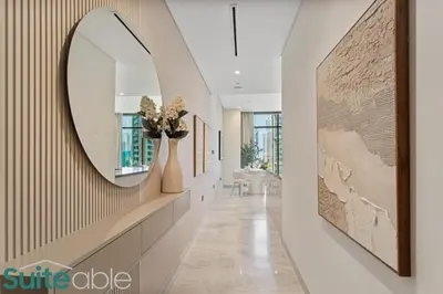 a hallway with a large mirror on the wall at Luxury One Bedroom with Burj Khalifa View in Dubai