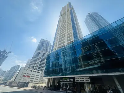 a group of tall buildings in a city at SUNRISE HOMES - A Modern Studio near JBR Beach in Dubai