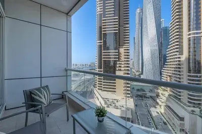 a balcony with a view of a city at SUNRISE HOMES - A Modern Studio near JBR Beach in Dubai