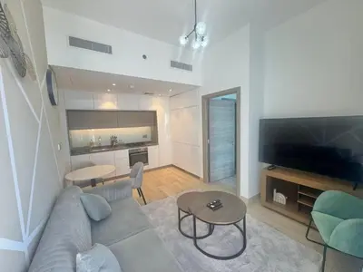 a living room with a couch and a table at Beautiful 1 bed apartment Marina I Sleeps 4 in Dubai