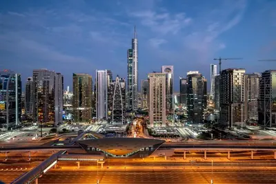 a view of a city at night with buildings at Lux 5BR Marina Apt with Jacuzzi, Walk to Beach, Gym in Dubai