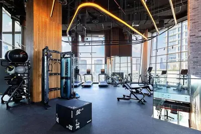 a gym with treadmills and exercise equipment in a building at Lavish Studio at 15 Northside W City Skyline View 3rd floor in Dubai