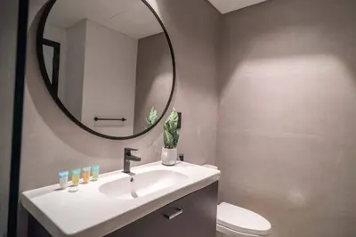 a bathroom with a sink and a mirror at Lavish Studio at 15 Northside W City Skyline View 3rd floor in Dubai