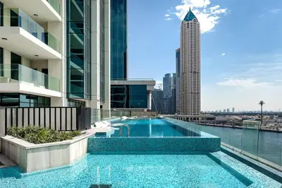 a swimming pool on the roof of a building at Convenient 1BR apartment in Business Bay in Dubai