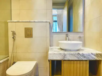 a bathroom with a sink and a toilet at ايكون ستي 2BEd in Dubai