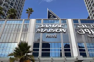 a building with a sign on the side of it at Vserve - Stylish specious - 1 Bedroom with Canal View in Dubai