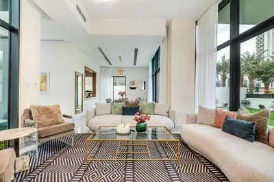 a living room with couches and a table at Dubai Luxury 4BR Villa in Murooj Al Furjan in Dubai