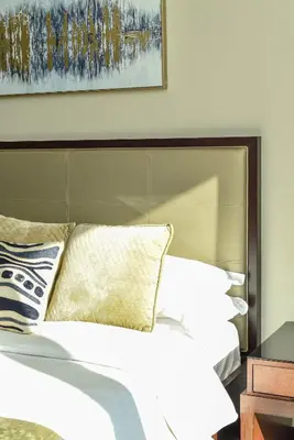 a bed with white sheets and pillows in a bedroom at Luxury Living At The Address Dubai Marina! in Dubai