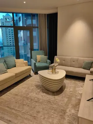 a living room with a couch and a coffee table at Seven Hotel Palm jumeirah in Dubai