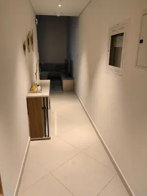 a room with a hallway with a white tile floor at Seven Hotel Palm jumeirah in Dubai
