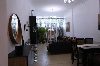 a living room with a couch and a table at Nice Place in Dubai