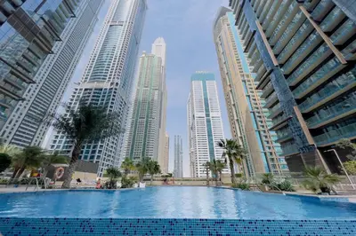 a swimming pool in a city with tall buildings at GuestReady - Marina Gate Studio Suite in Dubai