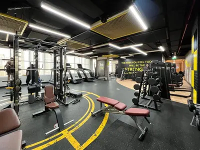 a gym with a lot of equipment in a room at GuestReady - Modern living in Downtown Dubai in Dubai