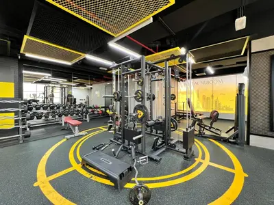 a gym with a bunch of equipment in a room at GuestReady - Modern living in Downtown Dubai in Dubai