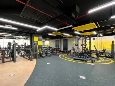 a gym with several treadmills and other equipment at GuestReady - Modern living in Downtown Dubai in Dubai