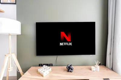 a television screen with the n on it in a living room at Urbane 1BR in Dubai Hills in Dubai