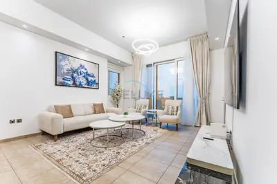 a living room with a couch and a table at Glance at the Royal Atlantis Right by Dubai Top Spots 2BR, Marina Apartments 3, Palm Jumeirah by Deluxe Holiday Homes in Dubai