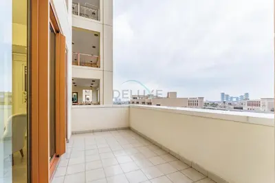 a balcony with a view of a city at Glance at the Royal Atlantis Right by Dubai Top Spots 2BR, Marina Apartments 3, Palm Jumeirah by Deluxe Holiday Homes in Dubai