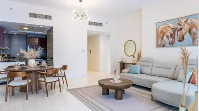 a living room with a couch and a table at Breathtaking Marina 2BR in Iconic Cayan Tower - 7AB08 in Dubai