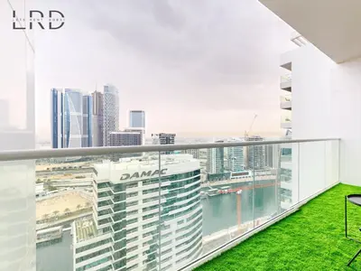 a view of the city from the balcony of a building at Elegant 1BR with Stunning Canal Views in Dubai